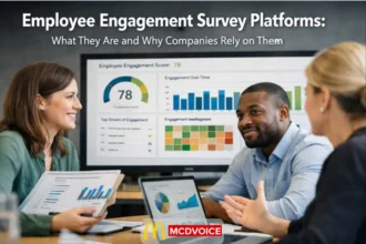 Team reviewing employee engagement survey results on a shared screen during a workplace discussion.